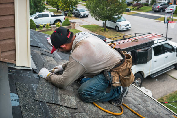 Professional Gutter Repair And Installation technician working in Lakewood, NY